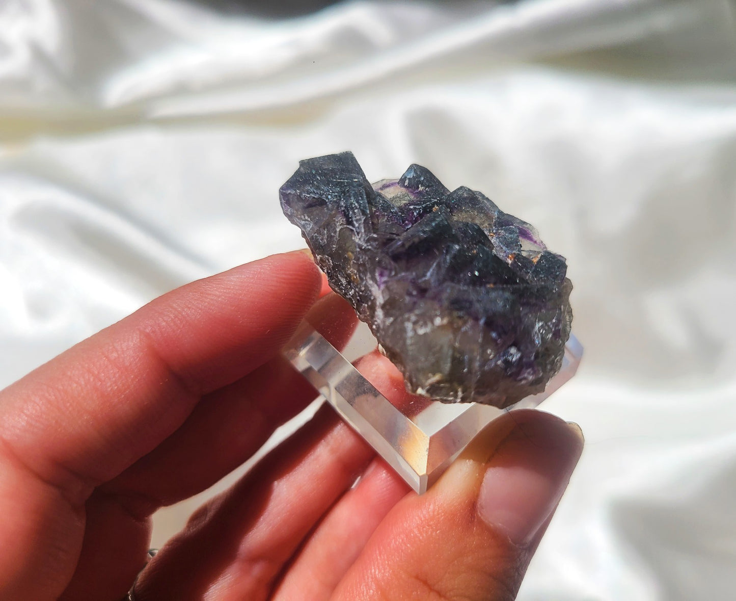 Rare Cubic Fluorite Specimen with Rutile inclusions on glass stand 02